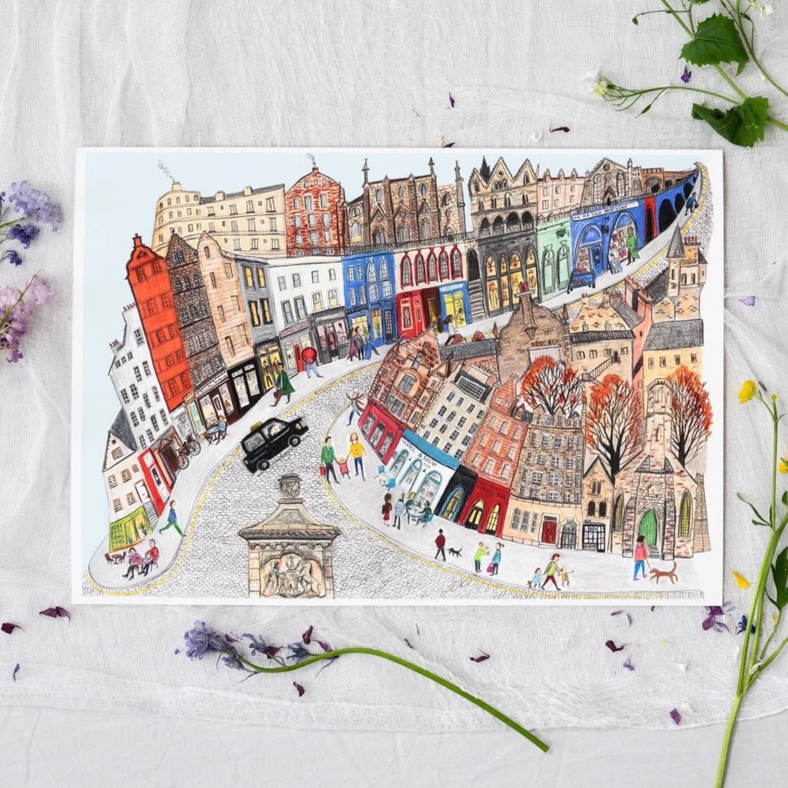 Colorful illustration of a street scene with buildings and people on a white background.