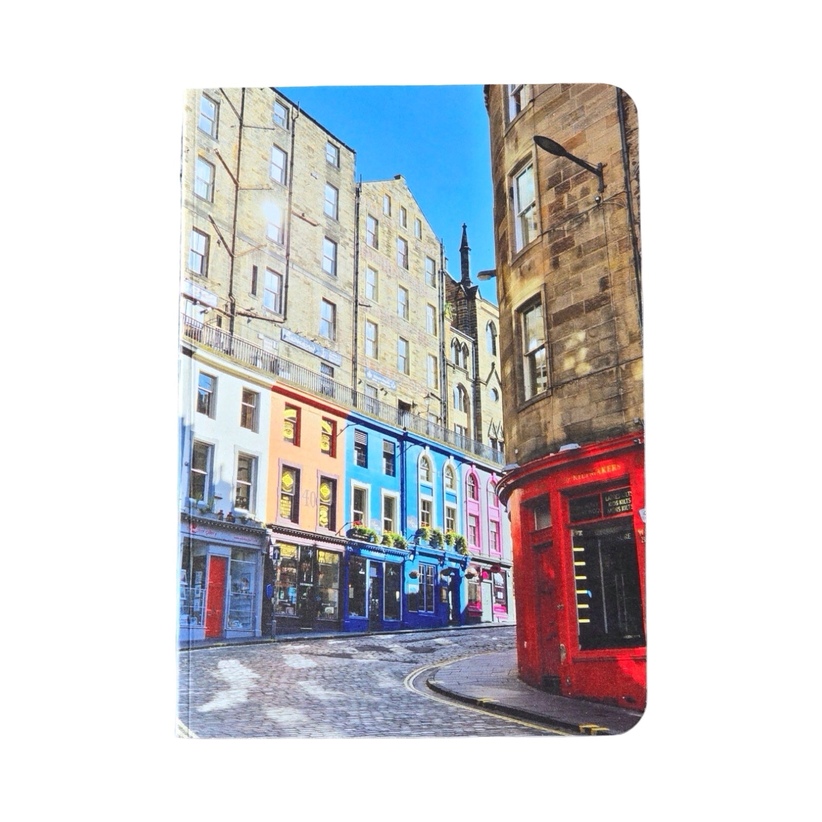 Colorful street scene with buildings and a red door on a white background