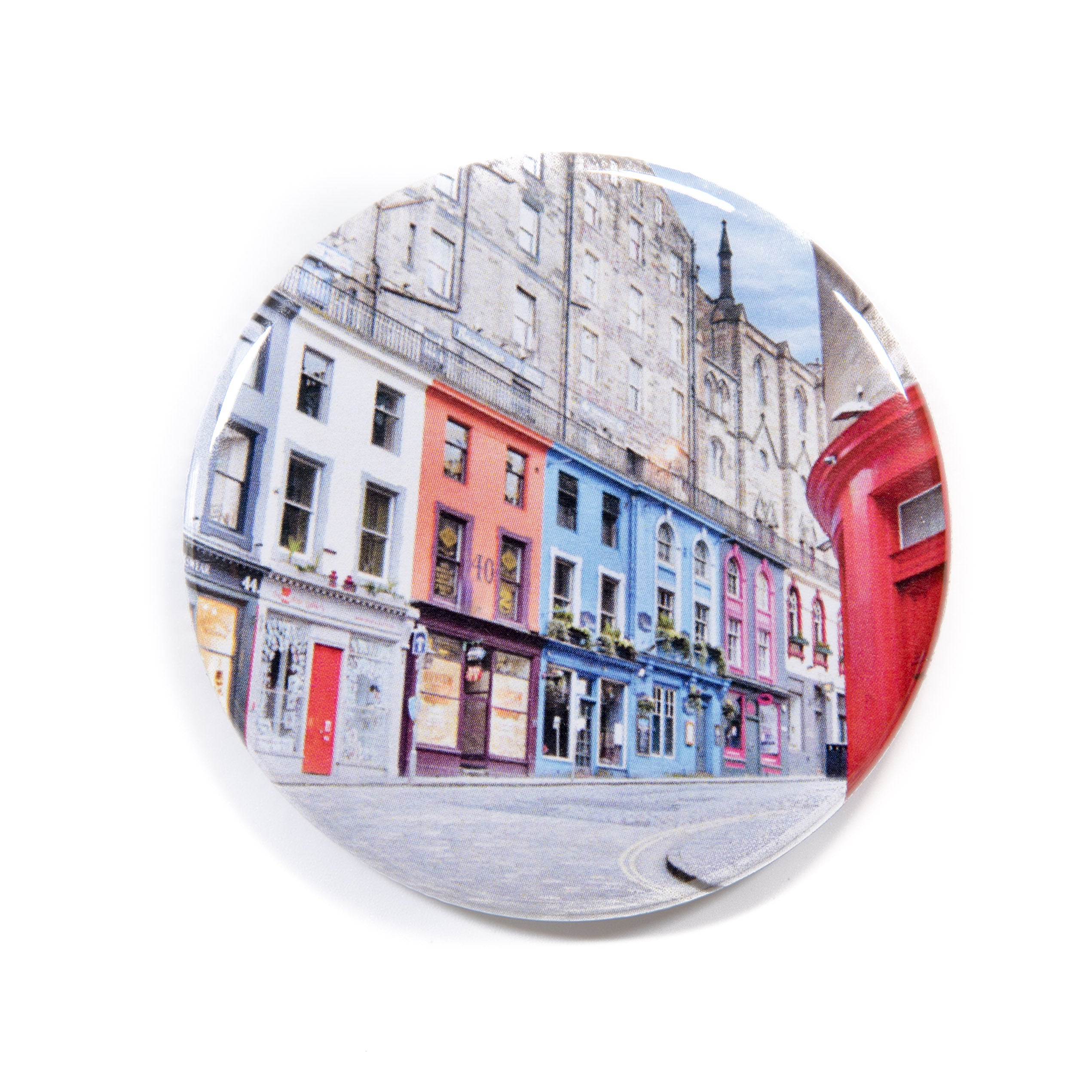 A colorful fridge magnet depicting Victoria Street in Edinburgh with a vibrant and detailed image.
