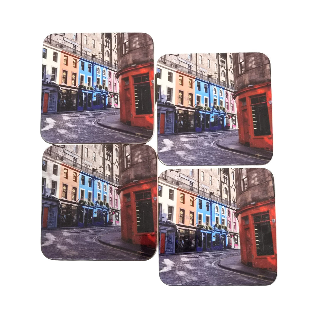 Set of four coasters with a city street design on a white background