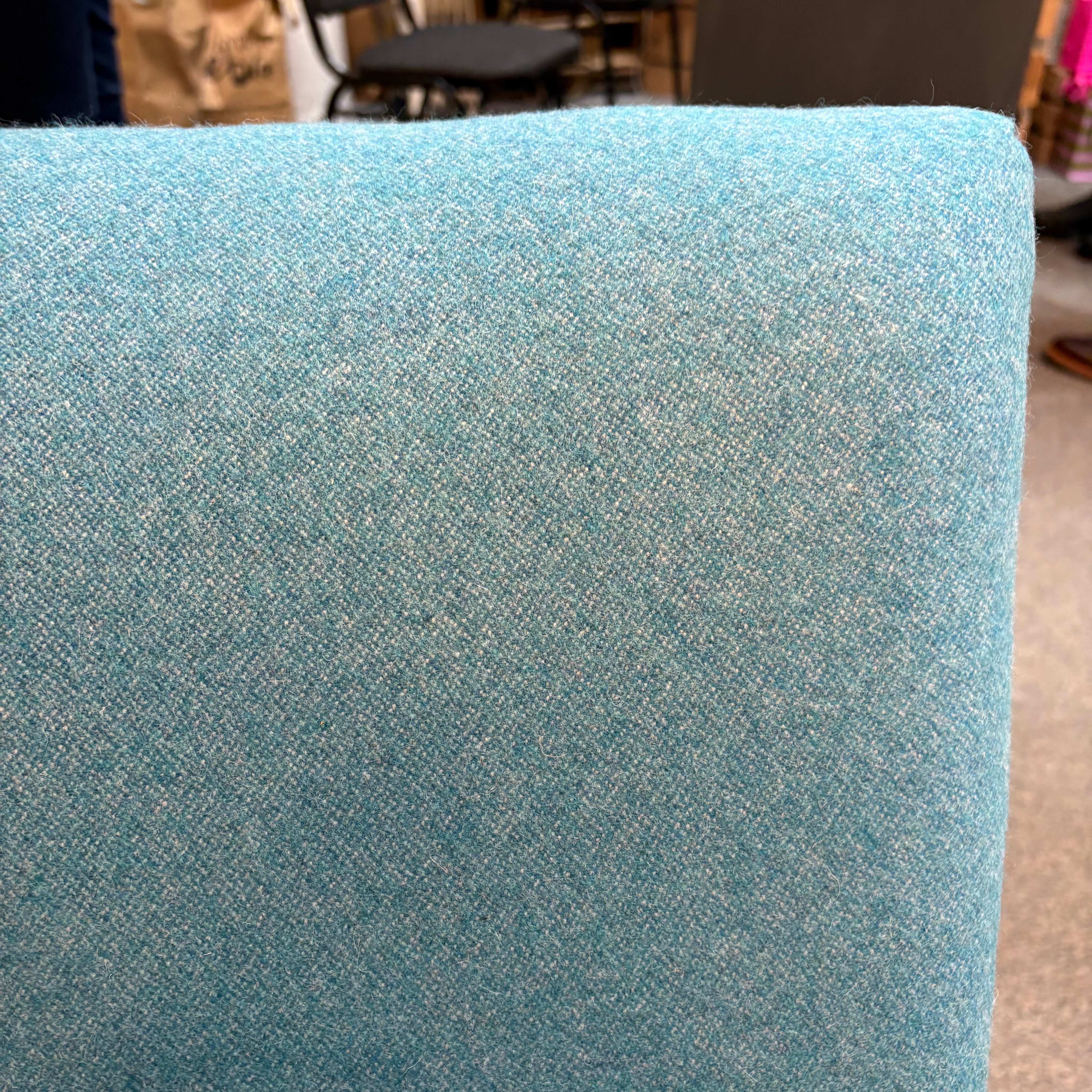 Close-up of a textured blue fabric surface.