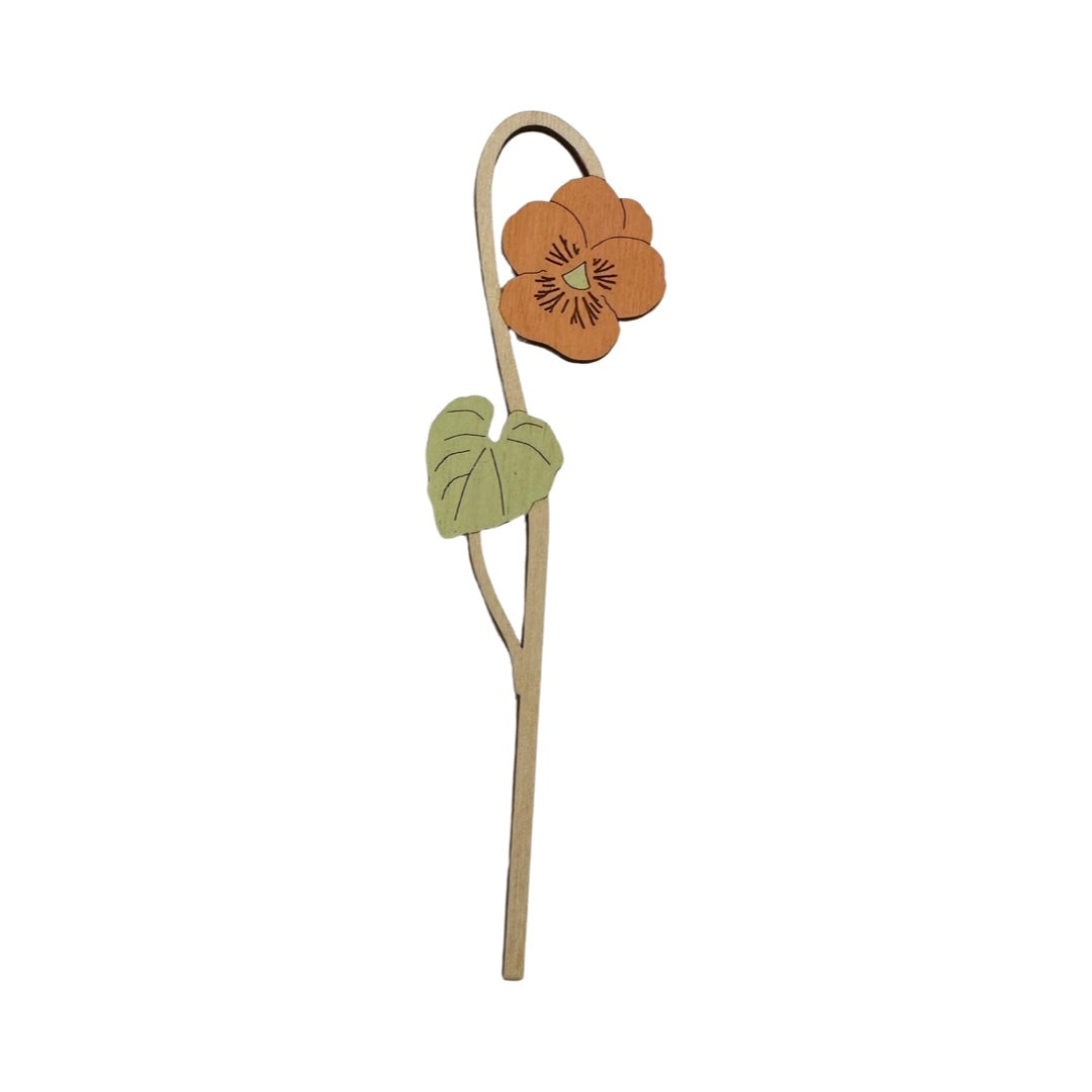 Single viola wooden stem with an orange flower and a green leaf.