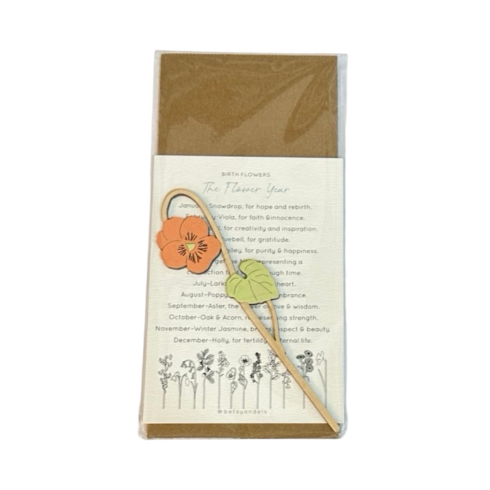 Single viola wooden stem with an orange flower and a green leaf  in a cellophane packet.