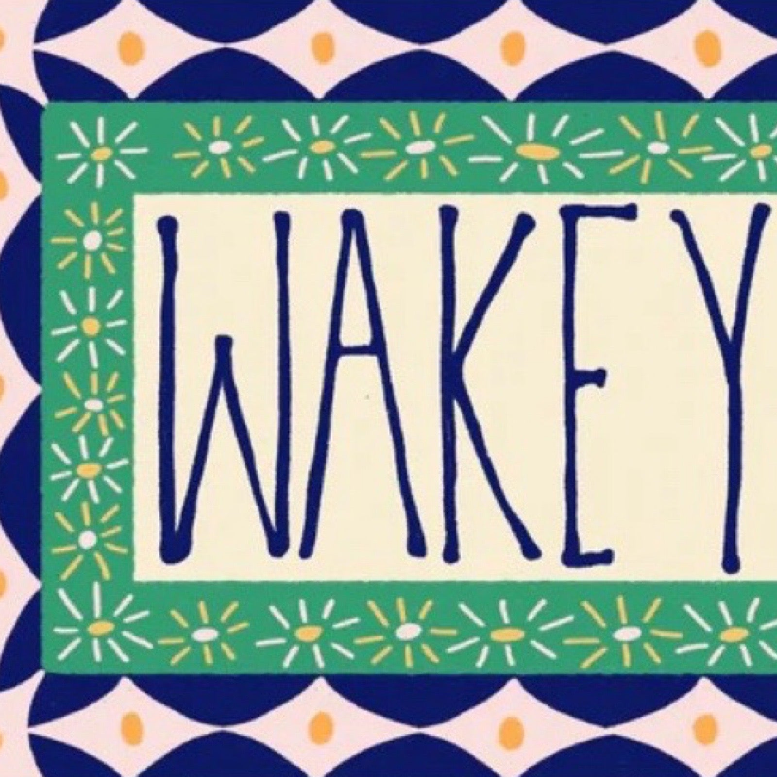 Decorative sign with 'Wakey' text.