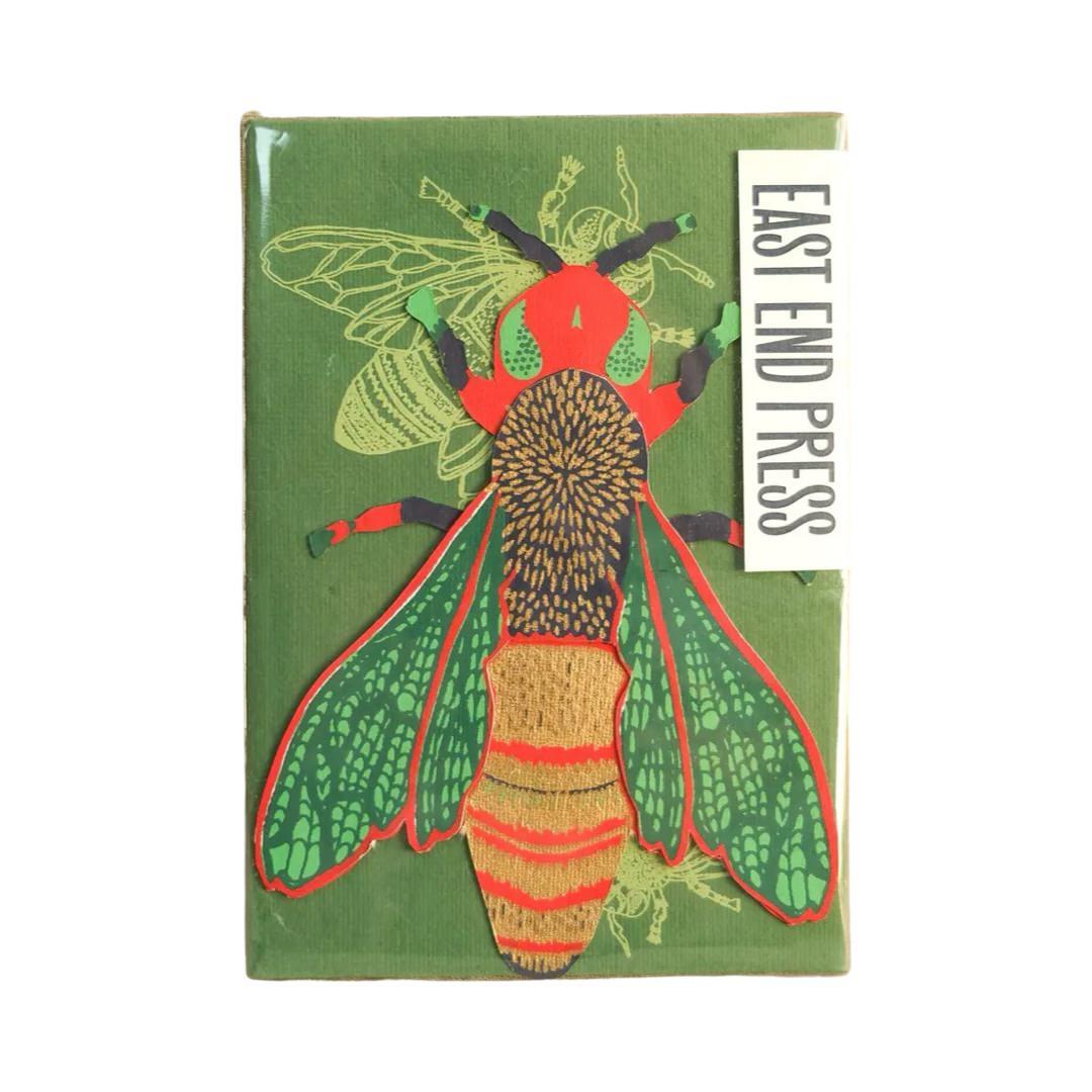 A wasp-shaped pop up card and envelope in a cello sleeve.