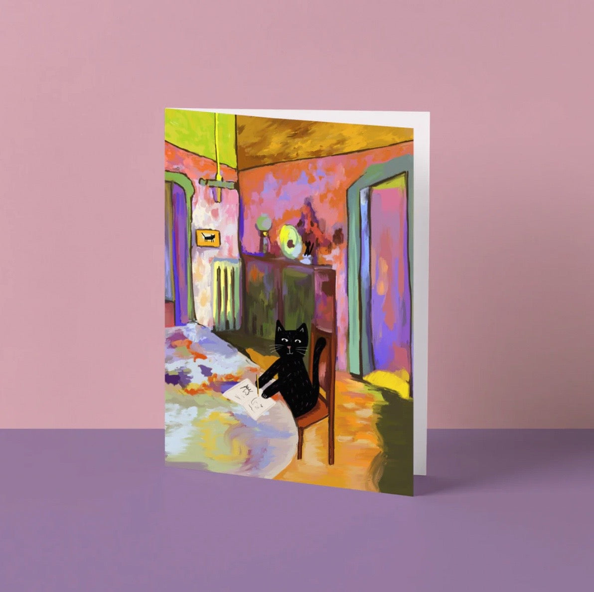 Greeting card with a colorful interior scene featuring a black cat on a chair.