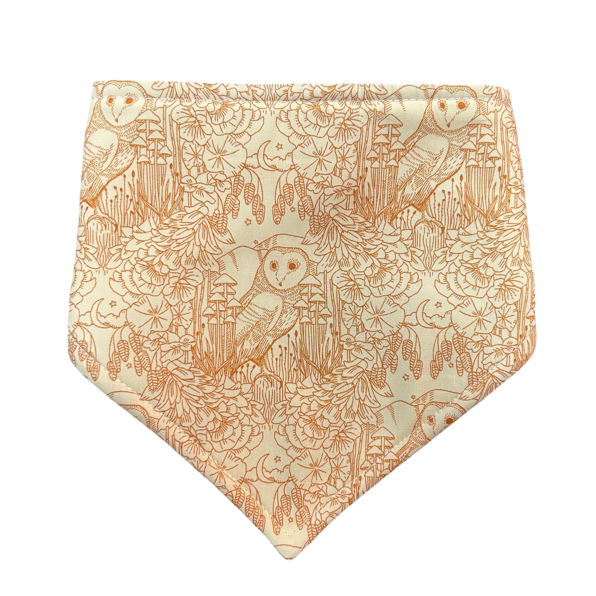 Bandana baby bib in pale yellow fabric with an outline drawing of owls and flora in orange.