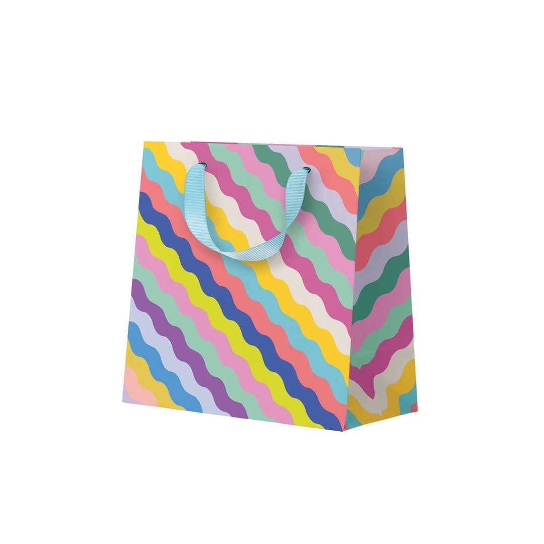 Colourful wavy patterned gift bag on a white background.