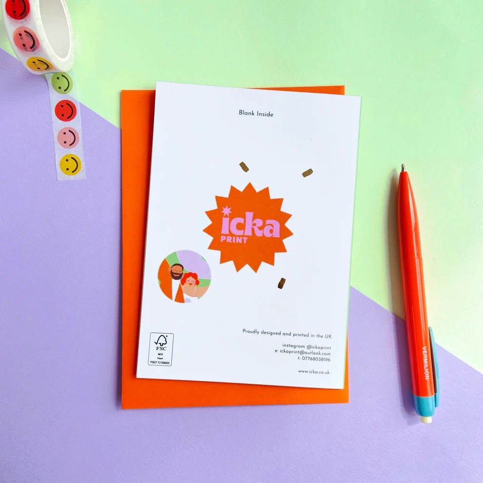 Back of card with branding, on a multicoloured table next to a pen and a sticker.