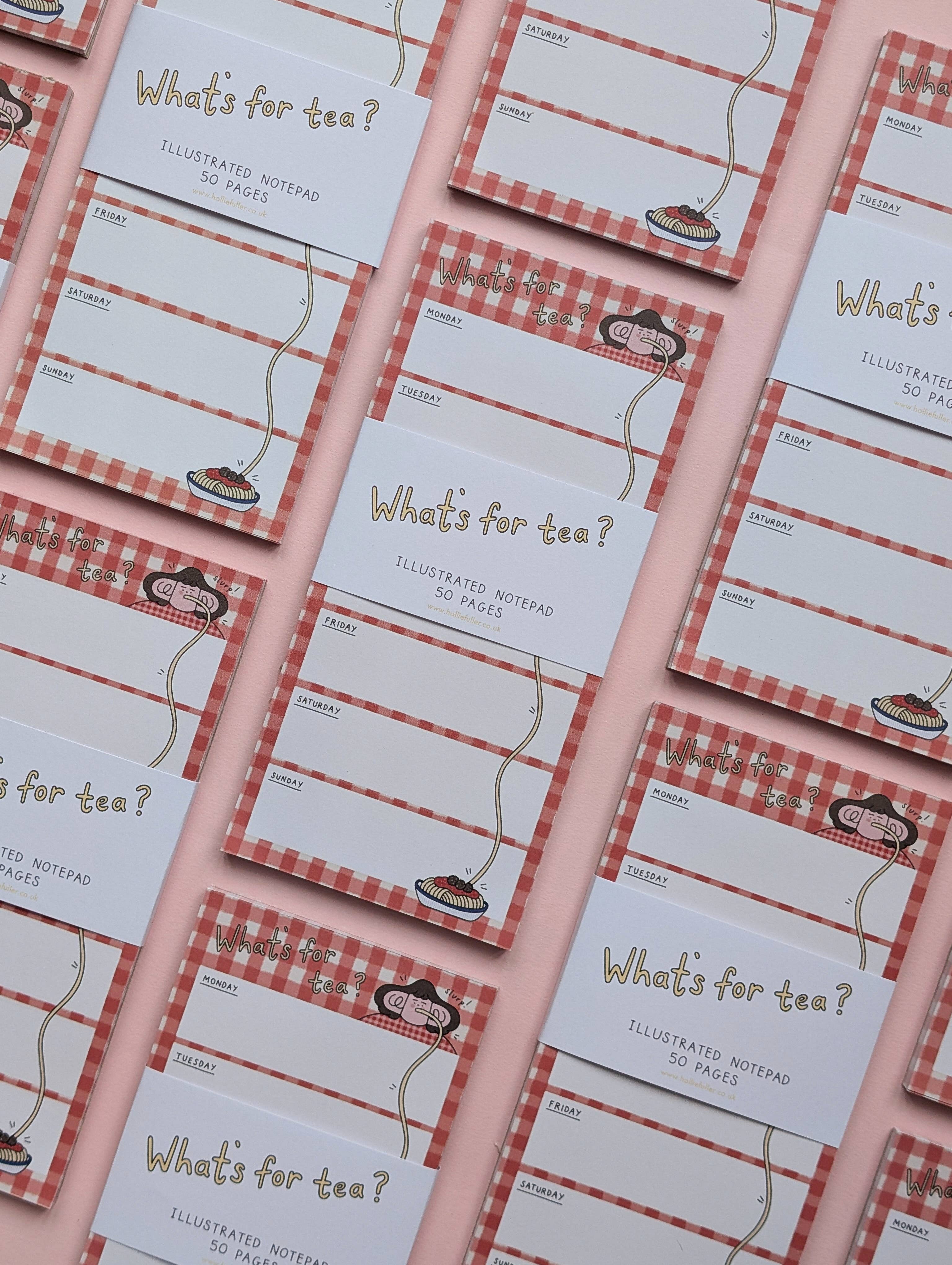 Multiple 'What's for tea?' illustrated notepads with red checkered borders on a matching pink background.