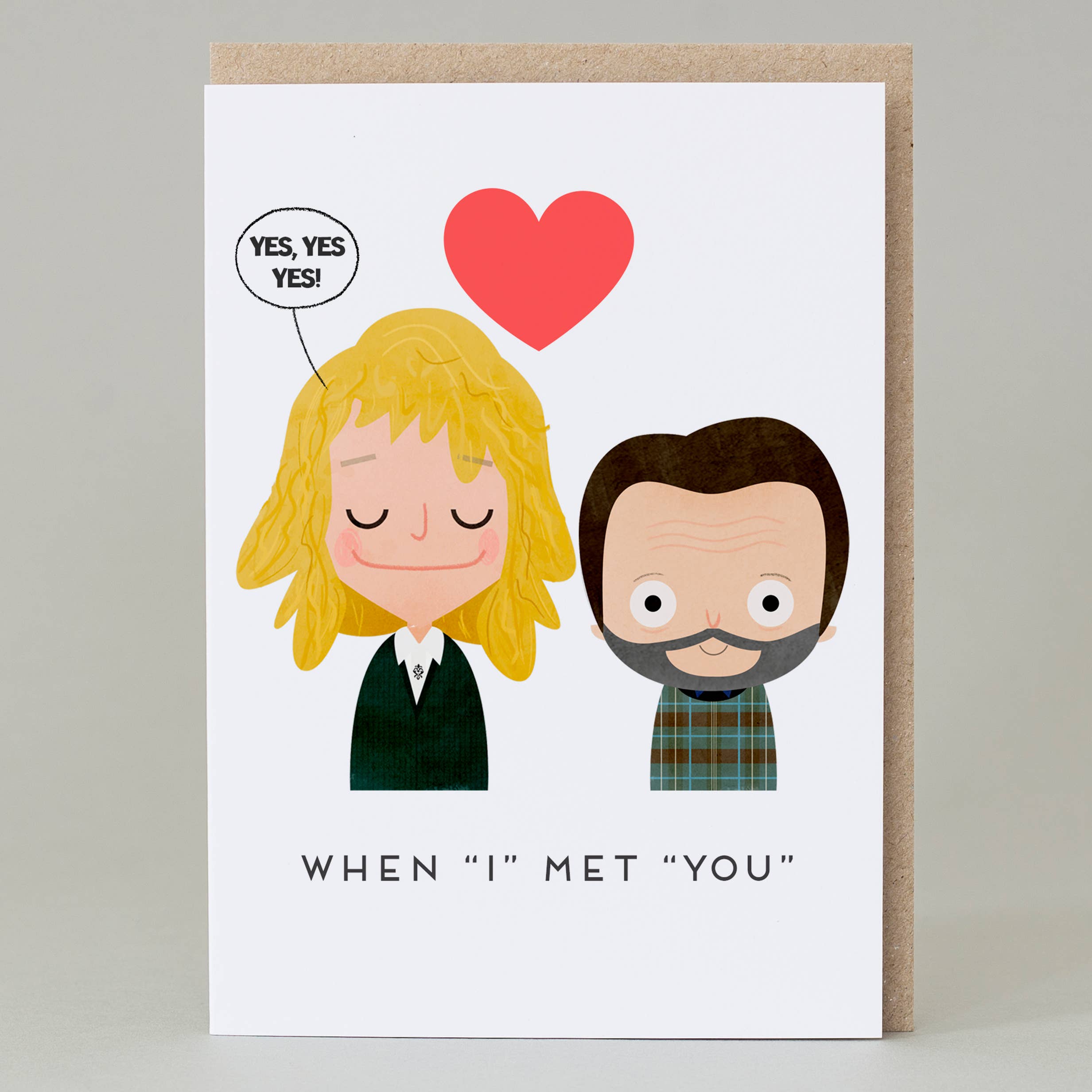 Greeting card with cartoon illustration of a couple and a heart symbol on a white background.
