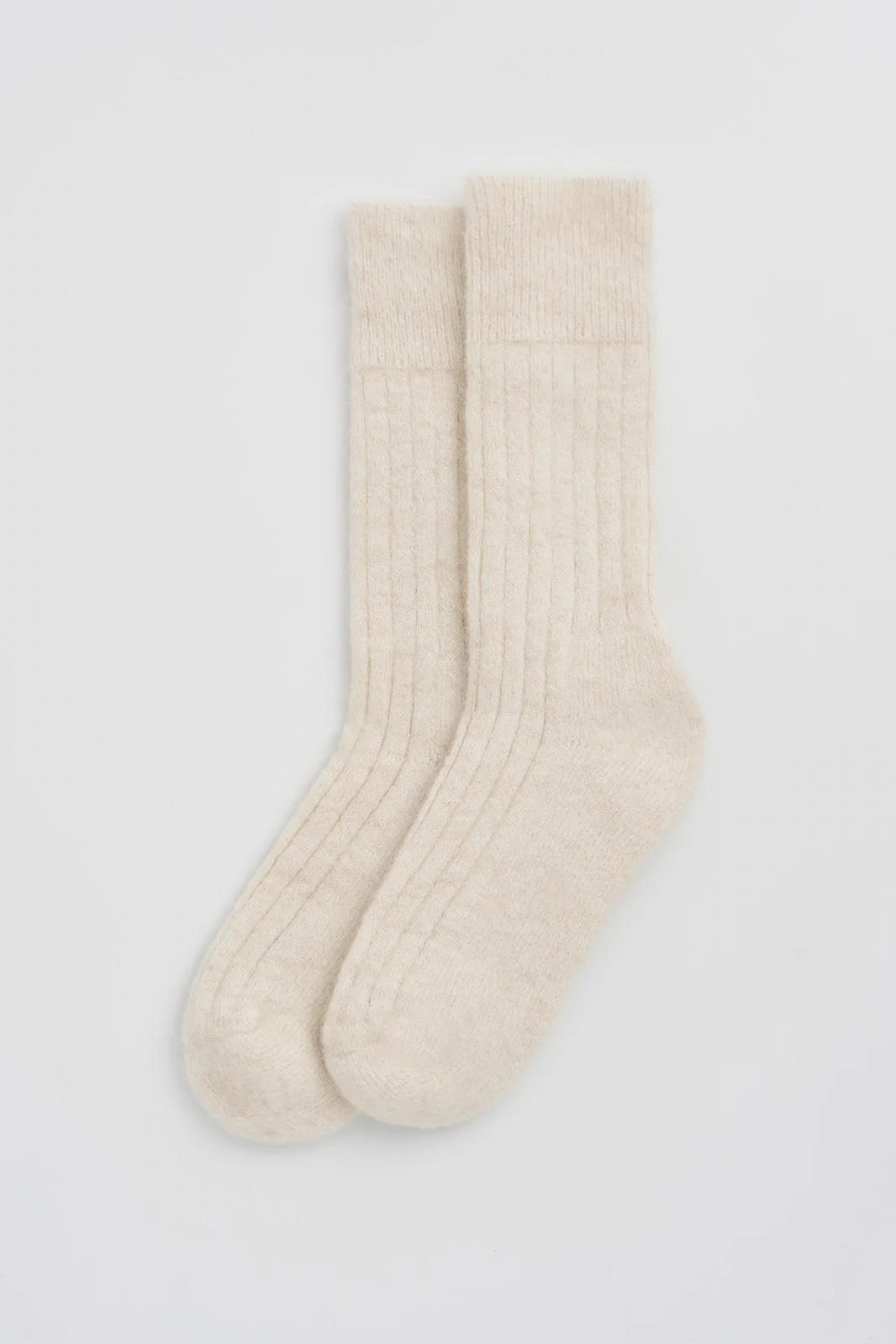 Pair of white socks on a white background.