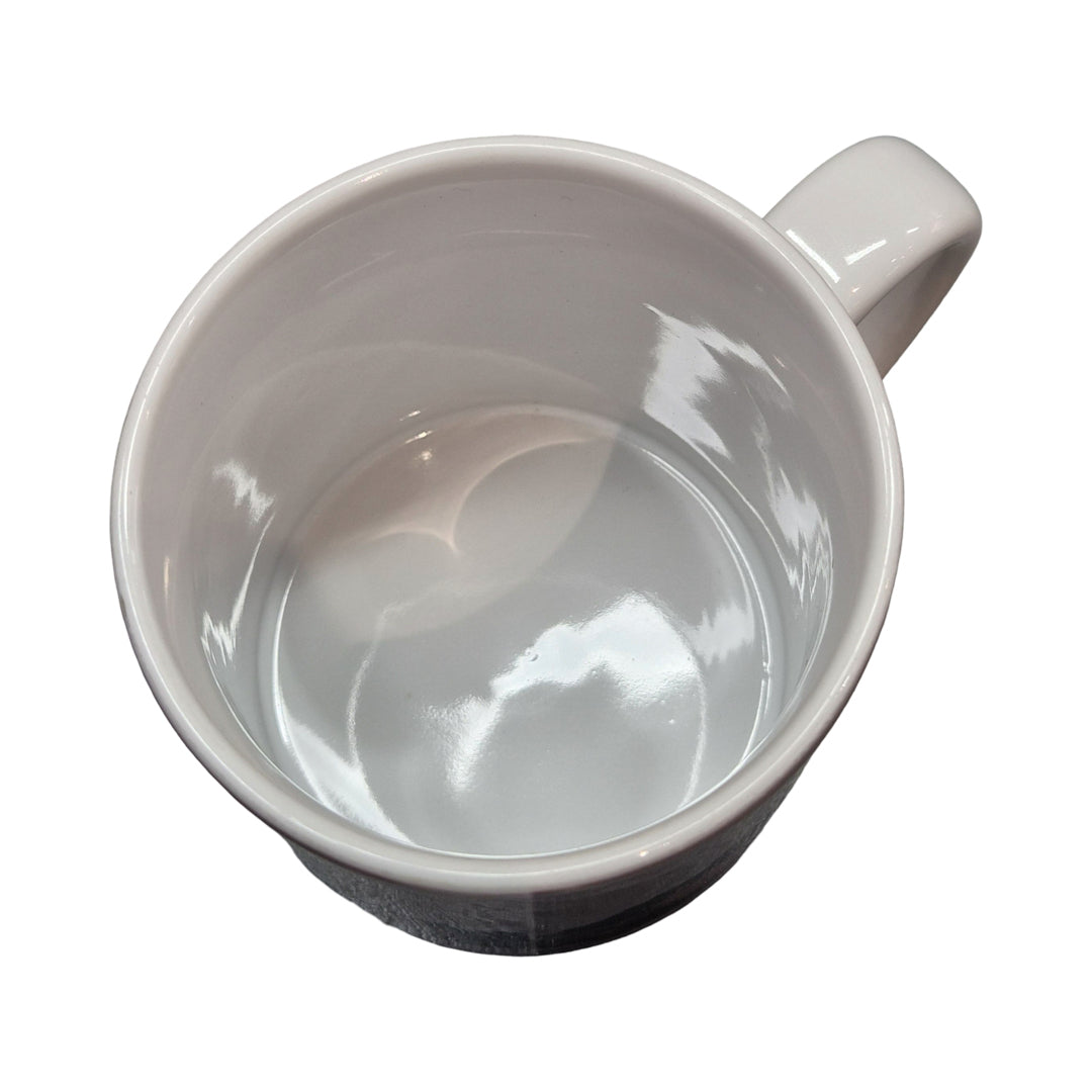 White ceramic mug on a white background