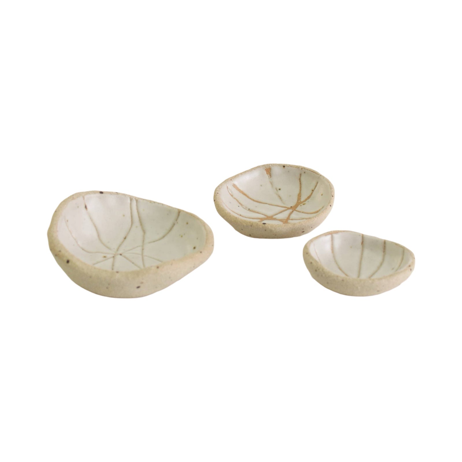 A set of 3 white patterned ceramic wonky bowls