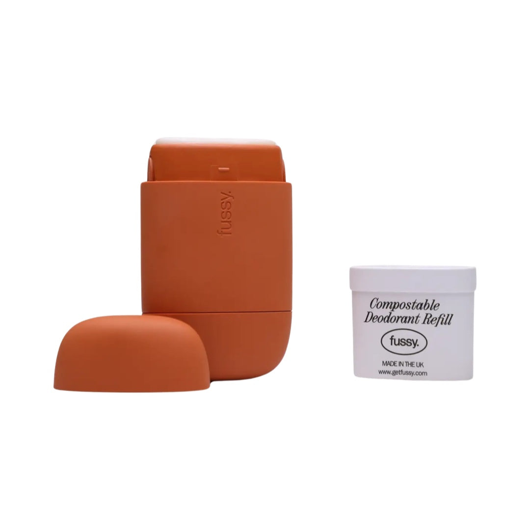 An orange refillable deodorant case and a fussy 'wide eyed' refill.