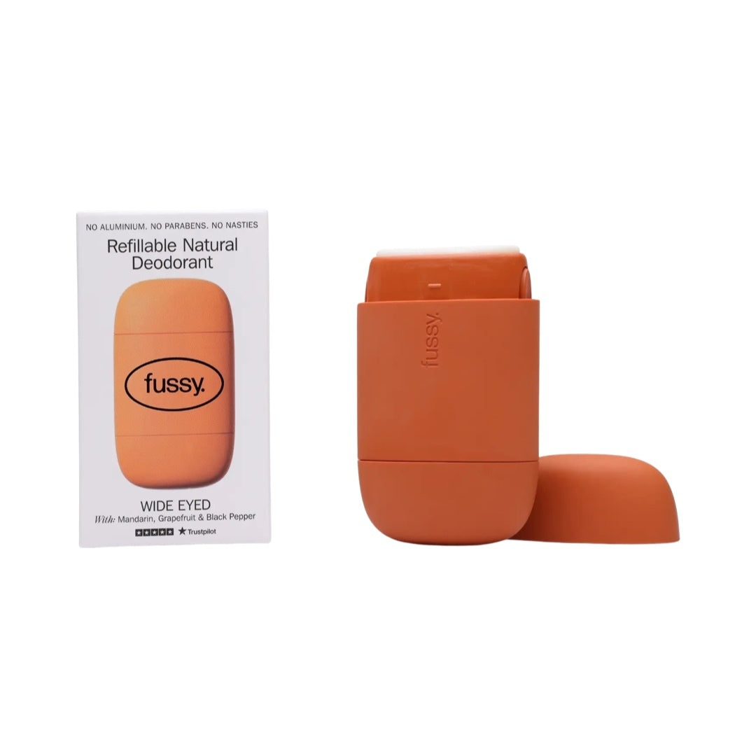An orange refillable deodorant case and a packet of fussy 'wide eyed' refillable deodorant.