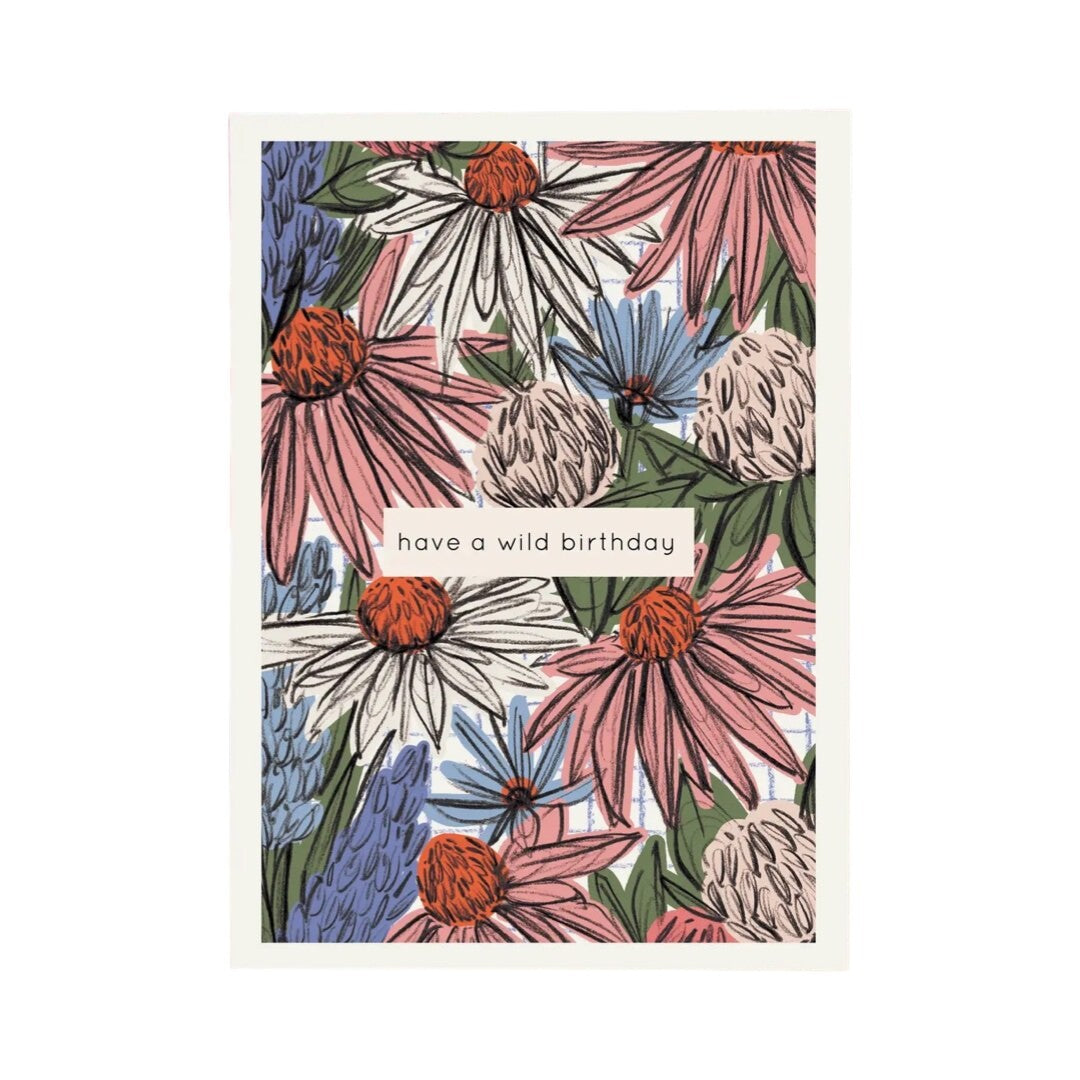 Birthday card featuring hand-drawn wildflowers in pink, white and blue and the text 'have a wild birthday' in a white box in the centre