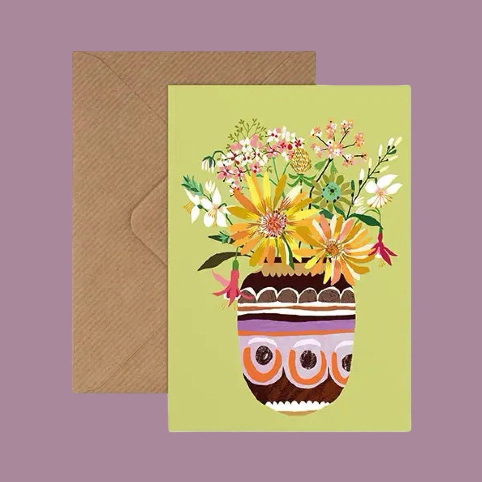 Greeting card with a colourful vase of flowers and a brown envelope on a purple background.