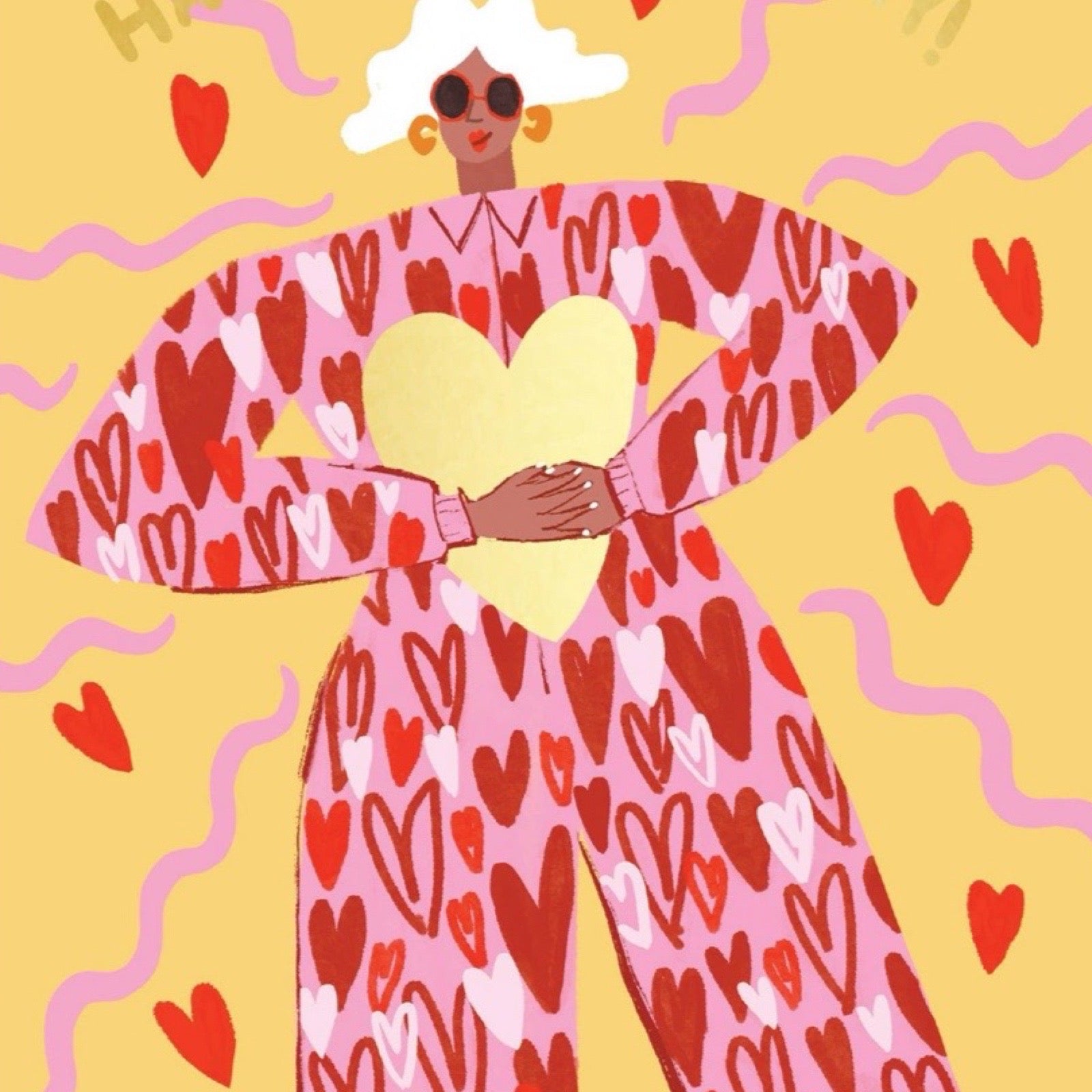 Mother's Day card featuring an illustration of a fabulous mum with white hair, wearing a red jumpsuit covered in love hearts, holding a giant gold love heart.