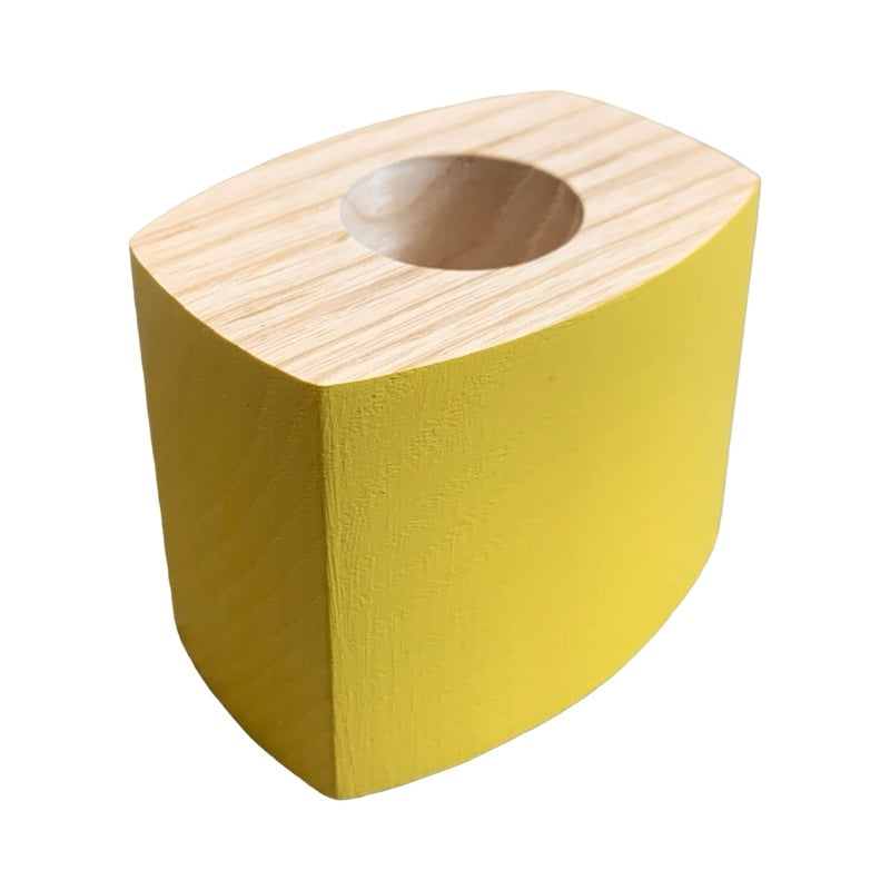 Yellow wooden candle holder.