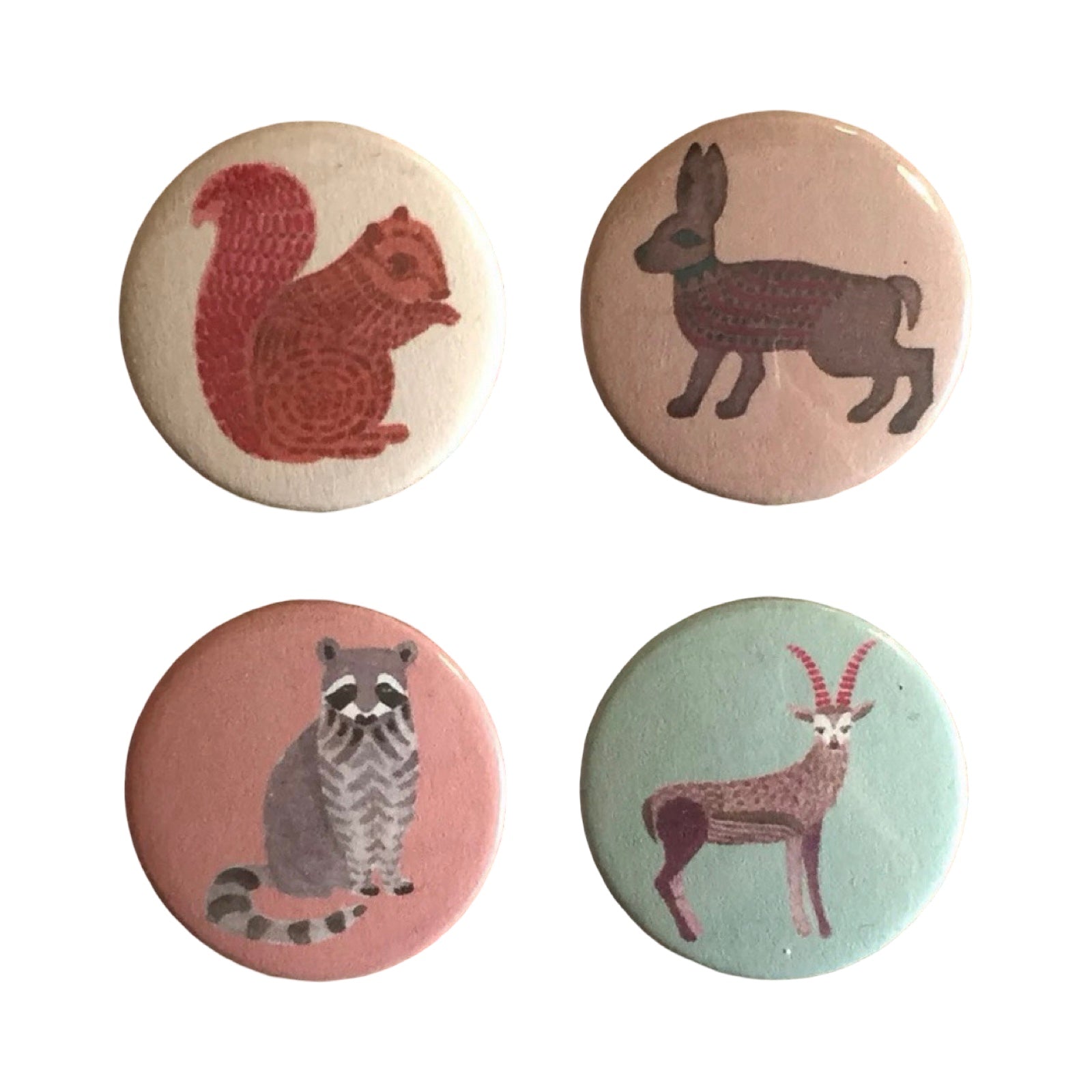 Four badges with animal illustrations on a white background.