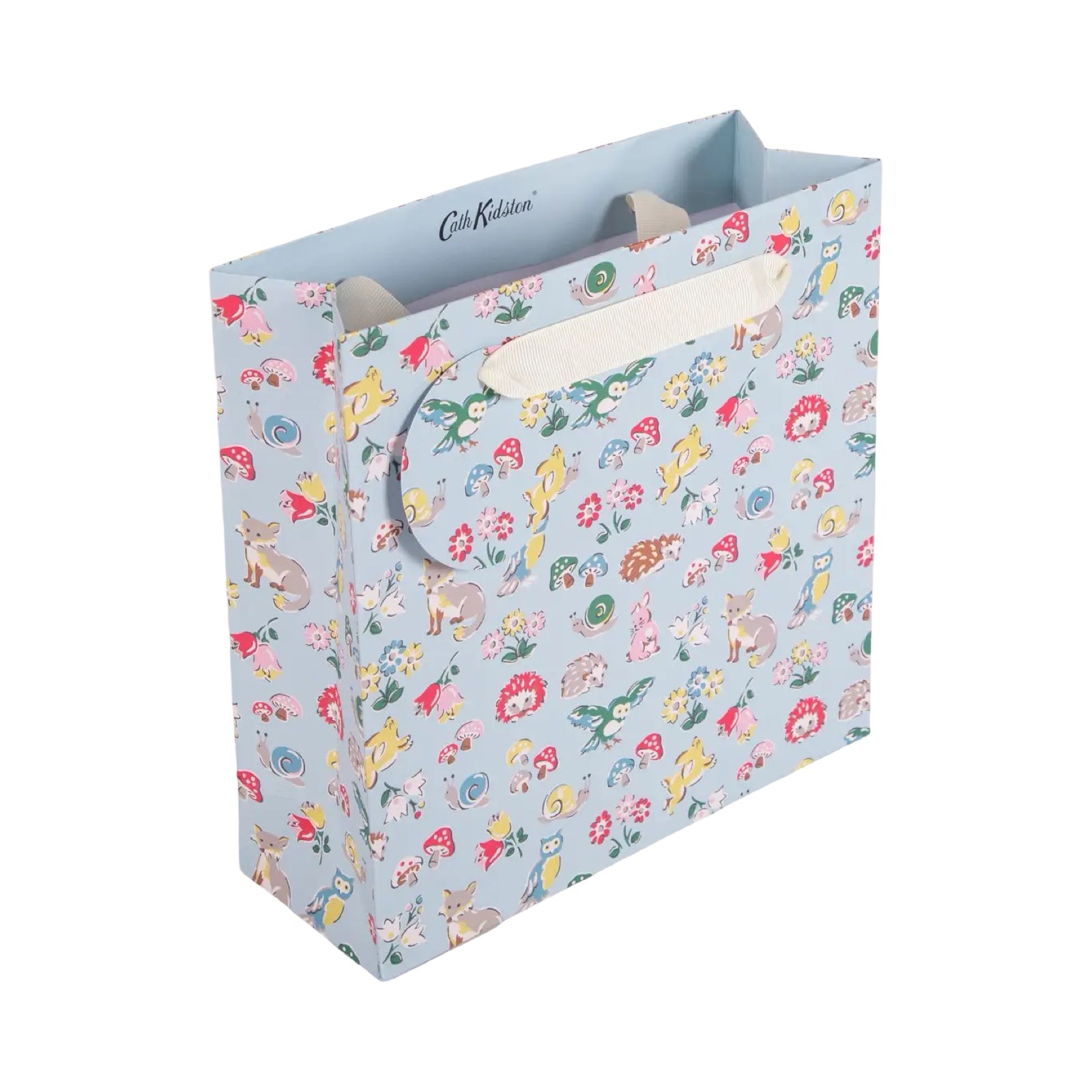Gift bag with colourful animal and floral pattern on a light blue background.