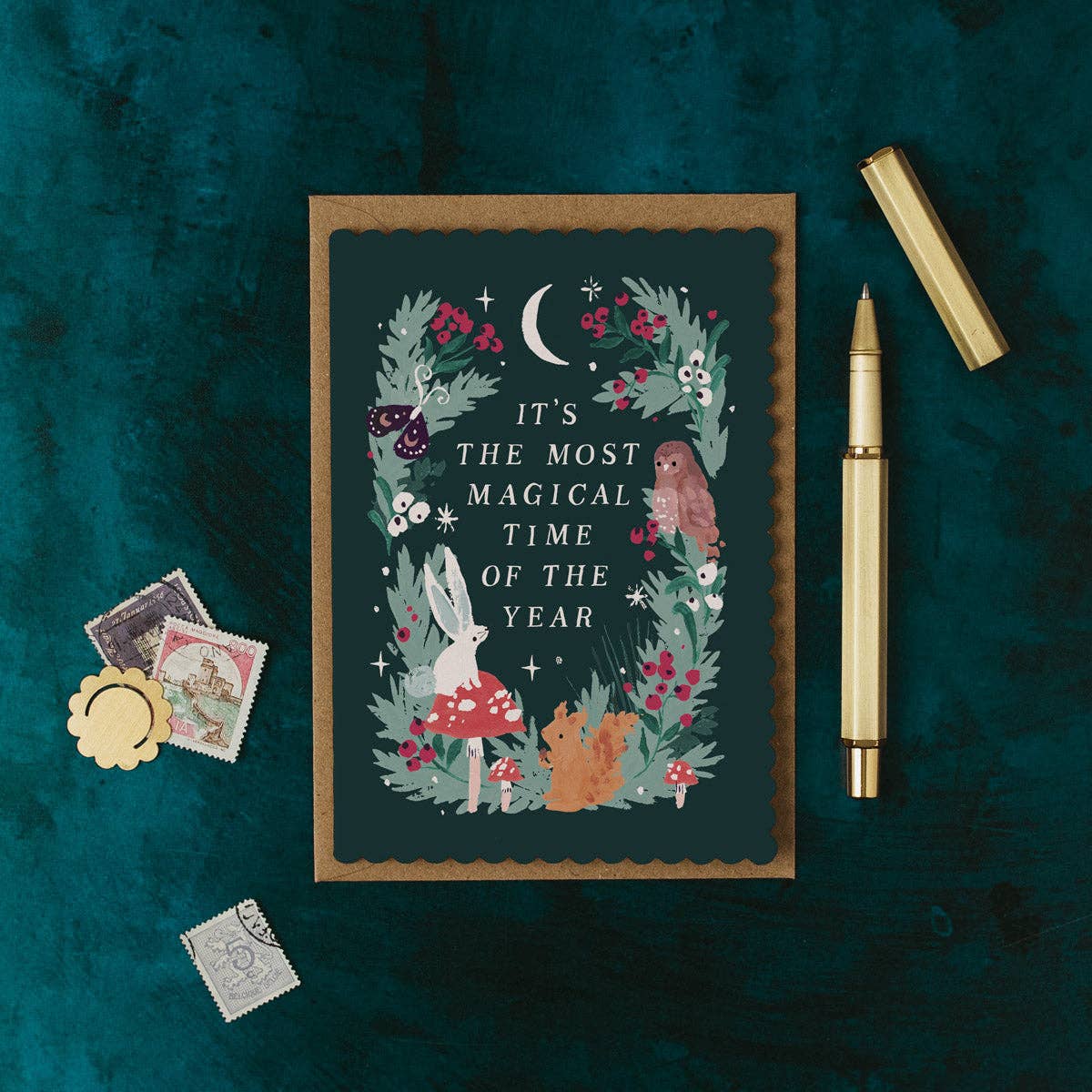 Decorative card with nature-themed design and text on a dark green background.