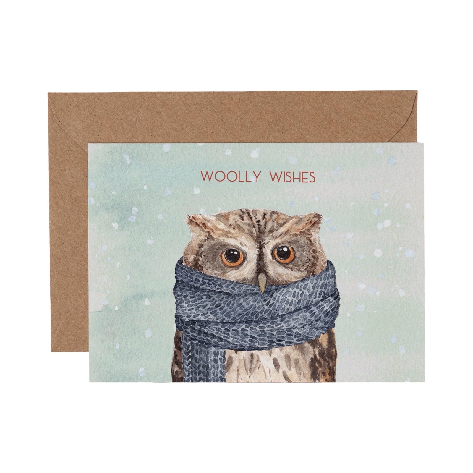 Greeting card with an owl wearing a scarf and 'Woolly Wishes' text, brown envelope.