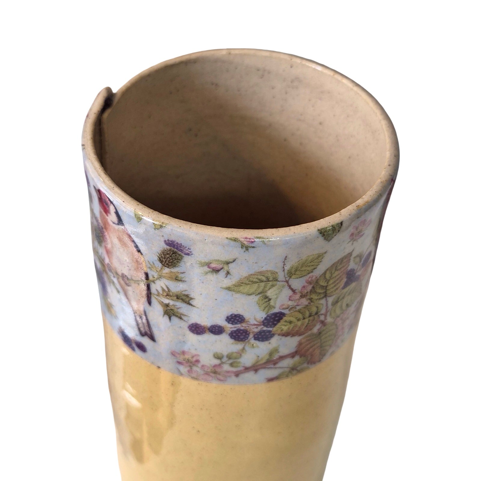 Ceramic vase with floral design on a white background.