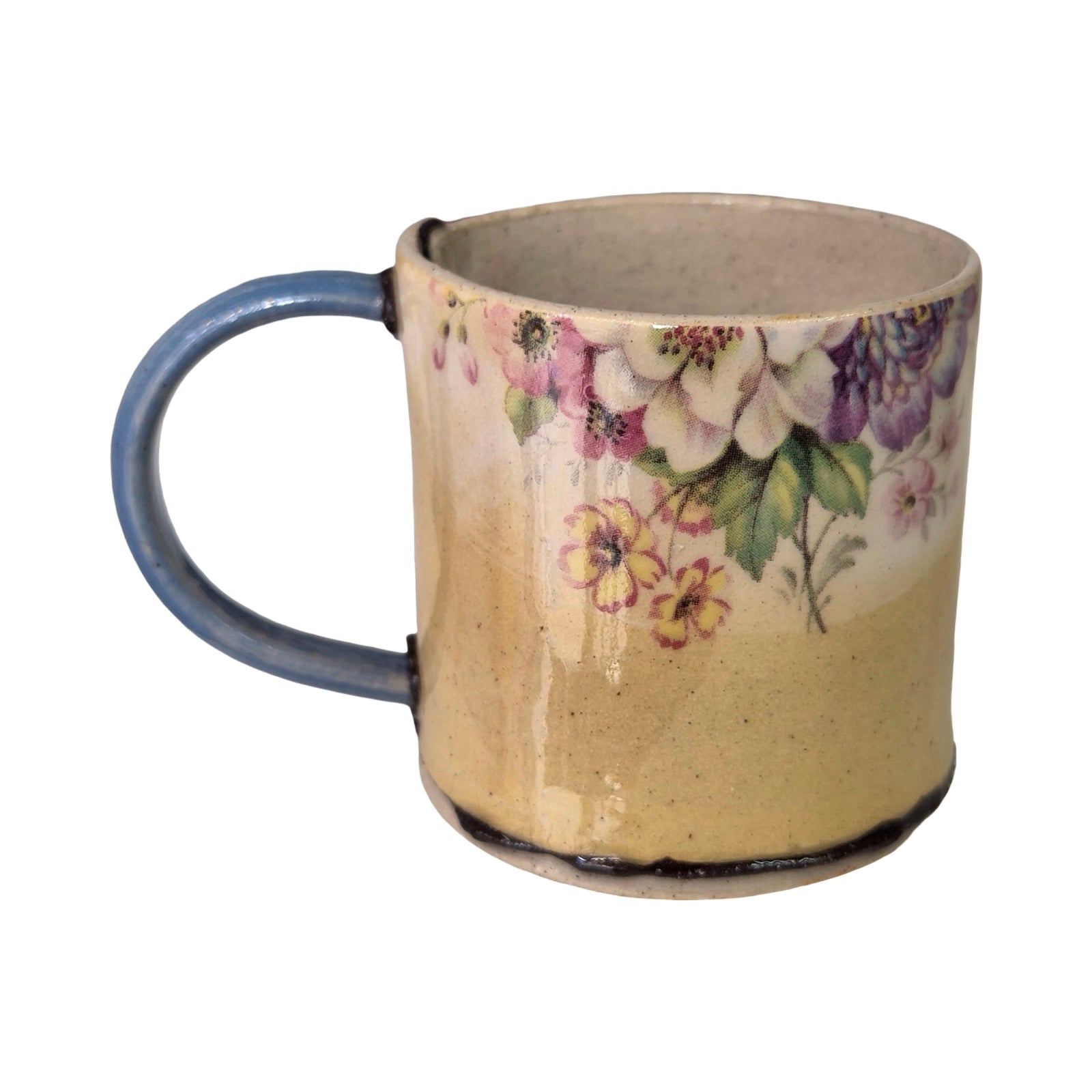 Ceramic mug with floral design on a beige background.