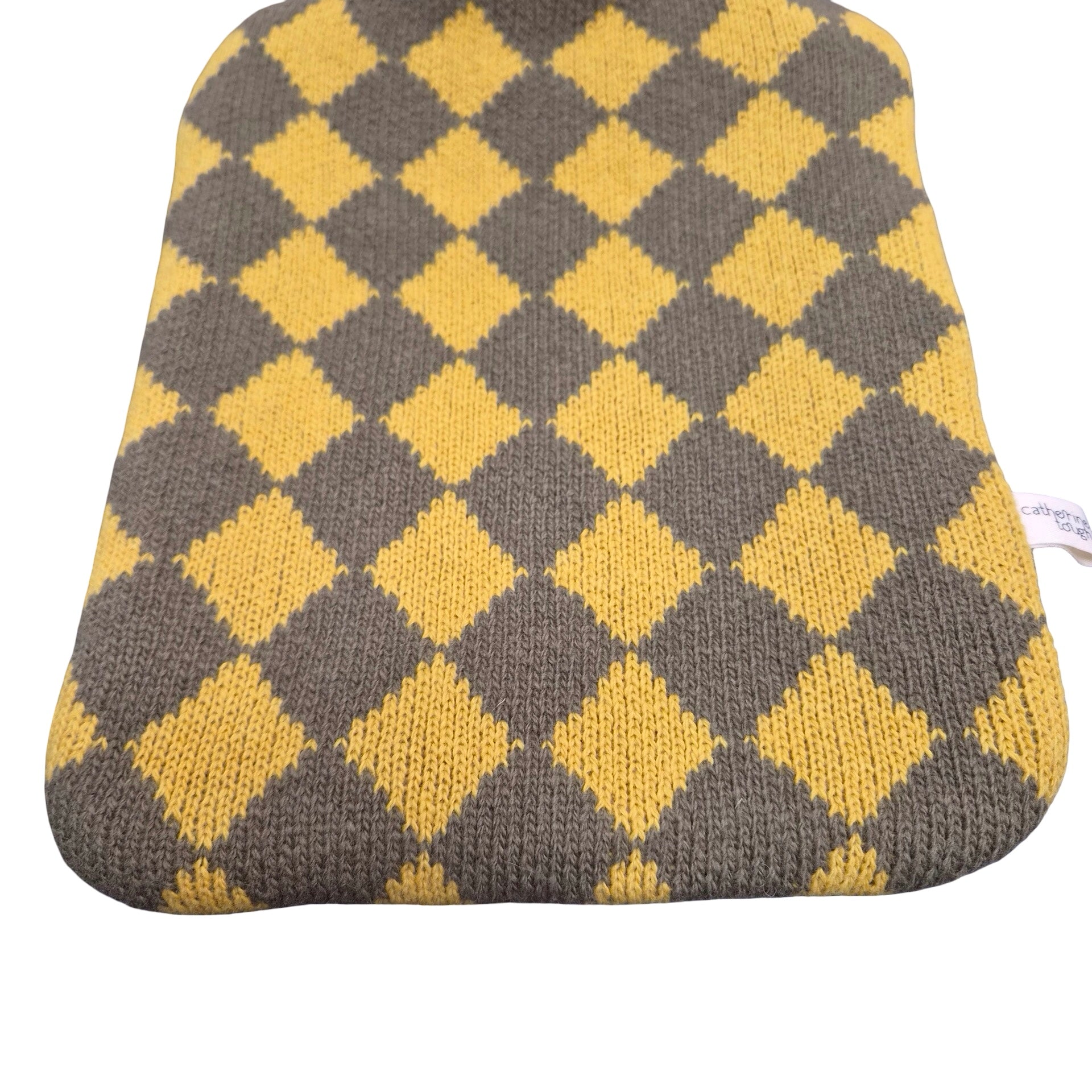 A knit hot water bottle cover featuring a yellow and dark grey argyle diamond pattern, shown against a plain white background.