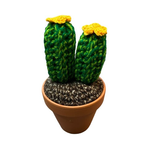 Handmade double stem crochet cactus with yellow flowers in a terracotta pot.