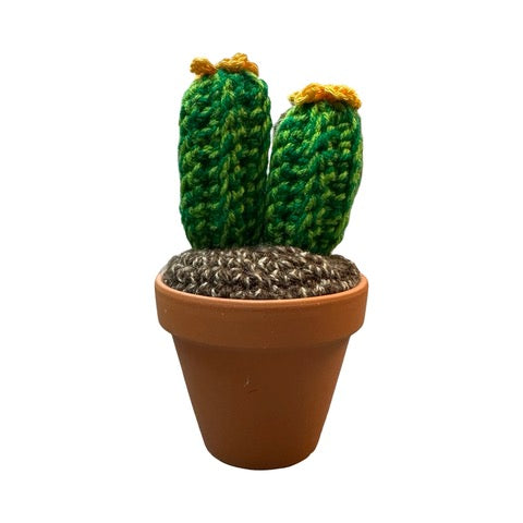 Handmade double stem crochet cactus with yellow flowers in a terracotta pot.