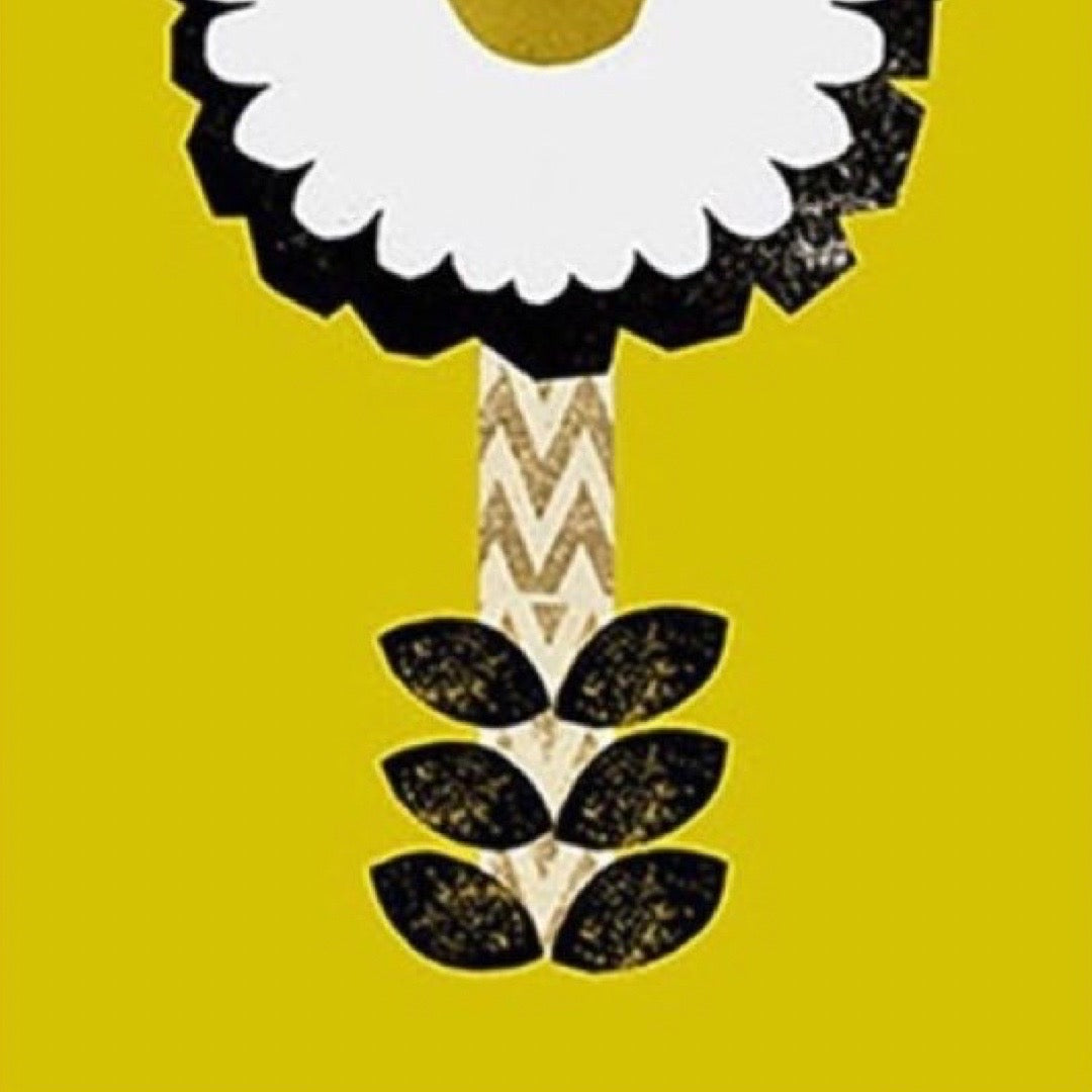 Decorative print with a white flower, black leaves, and gold center on a yellow background.
