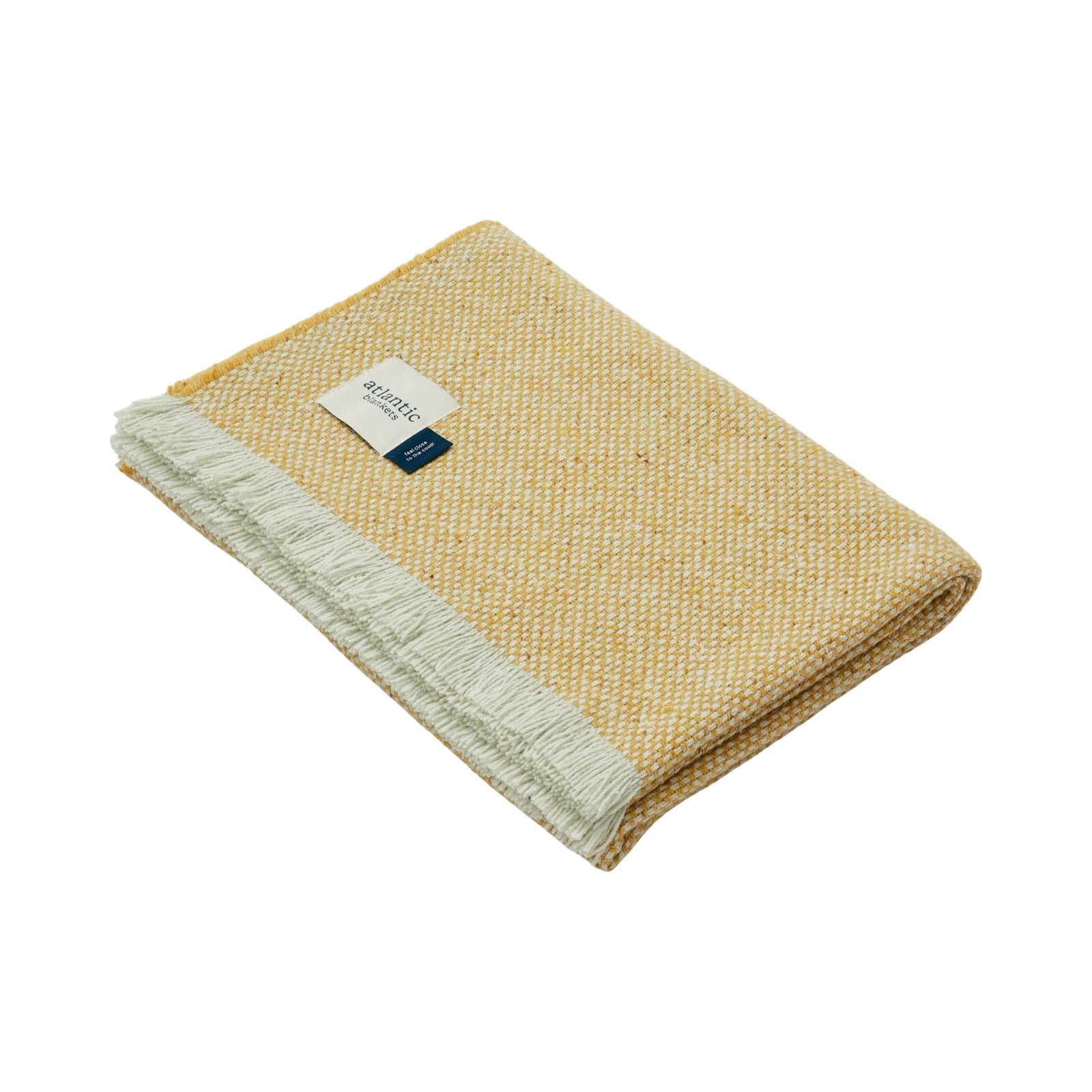 Cosy yellow blanket folded up.