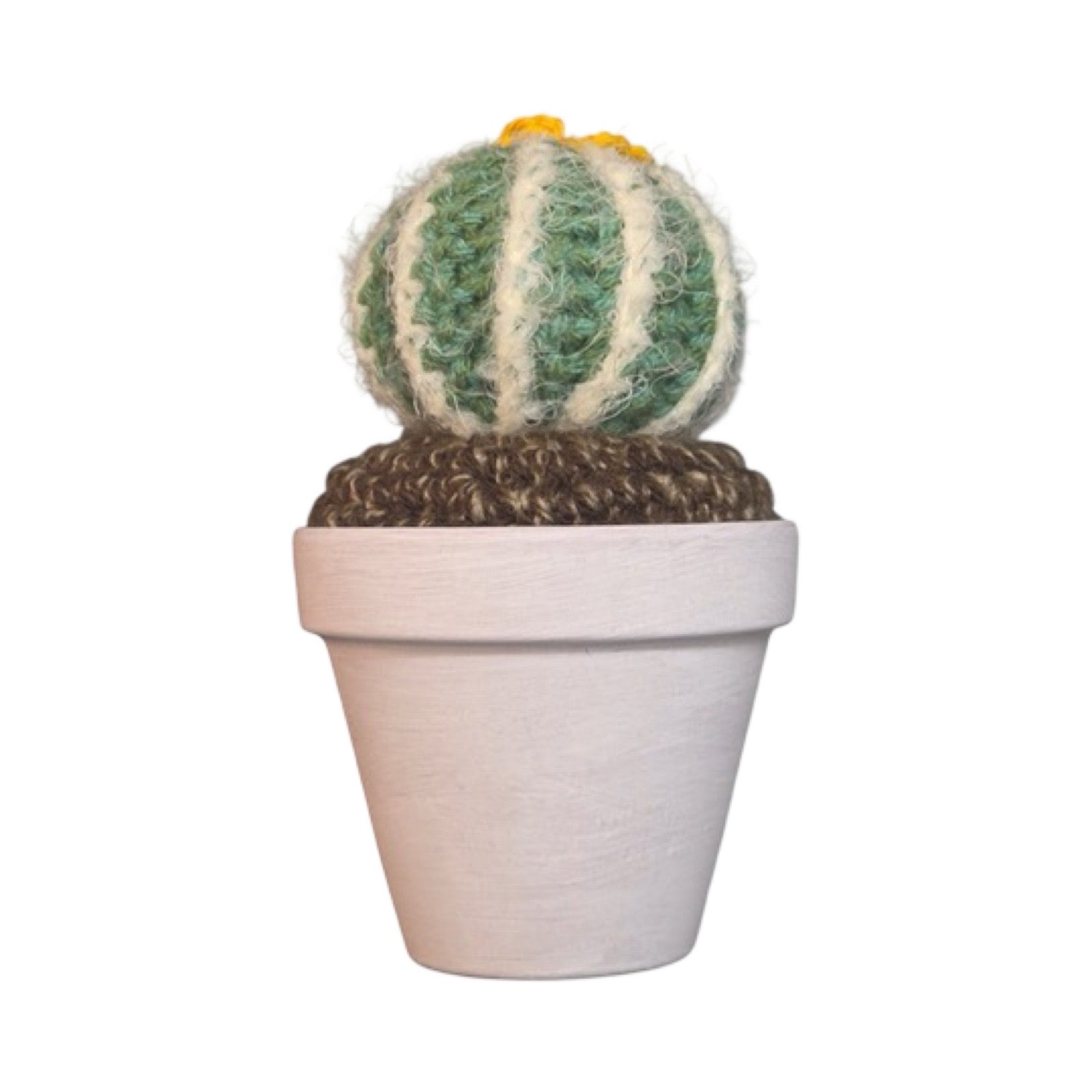 Handmade round crochet cactus with a yellow flower in a white painted terracotta pot.