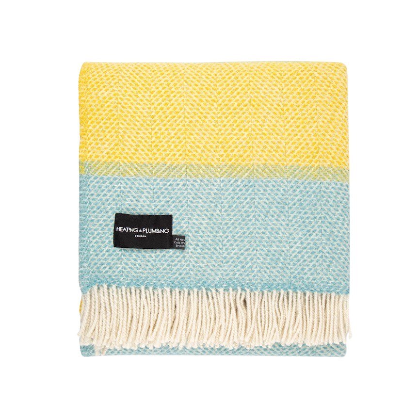 This yellow and pale blue striped super cosy and fluffy blanket is made from 100% pure new wool and finished with extra brushing to make it super soft.