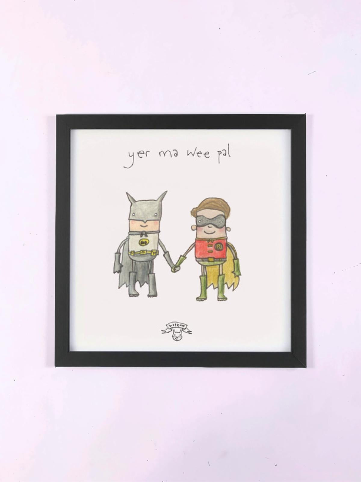 Print of an illustration of Batman and Robin holding hands, framed on a wall.