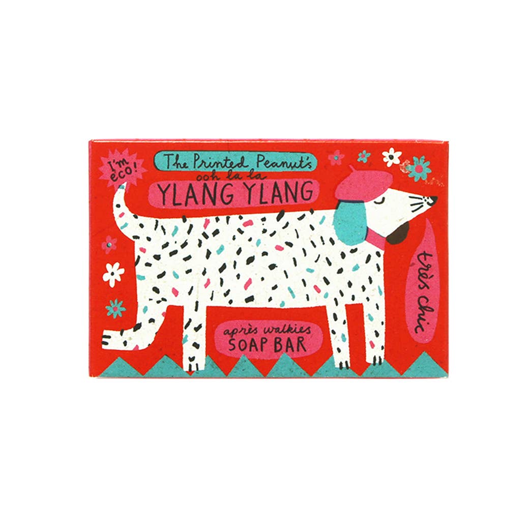 Soap bar packaging with a dog illustration and colourful design on a white background.