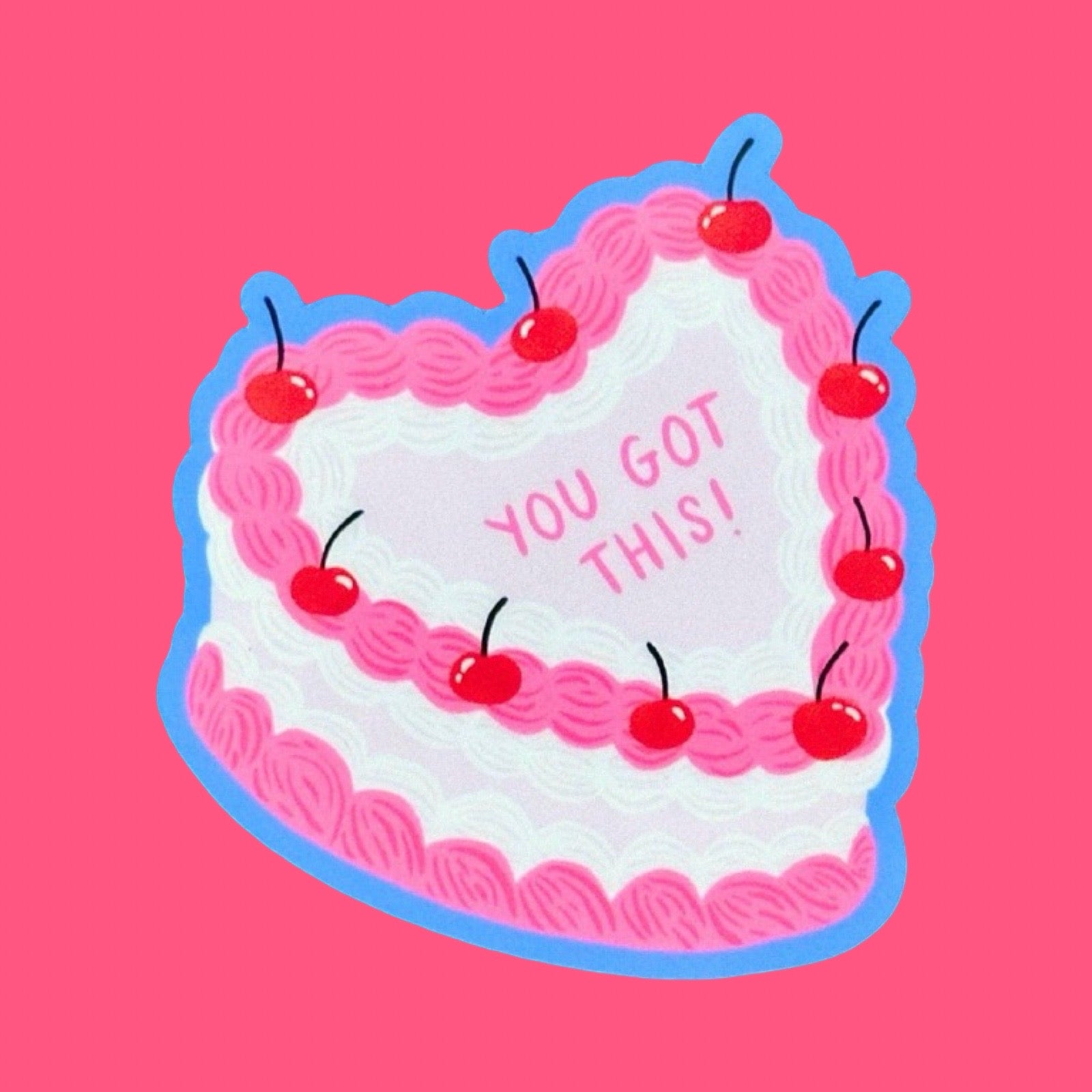 Heart-shaped cake with pink frosting, cherries, and 'You Got This!' text on a pink background.