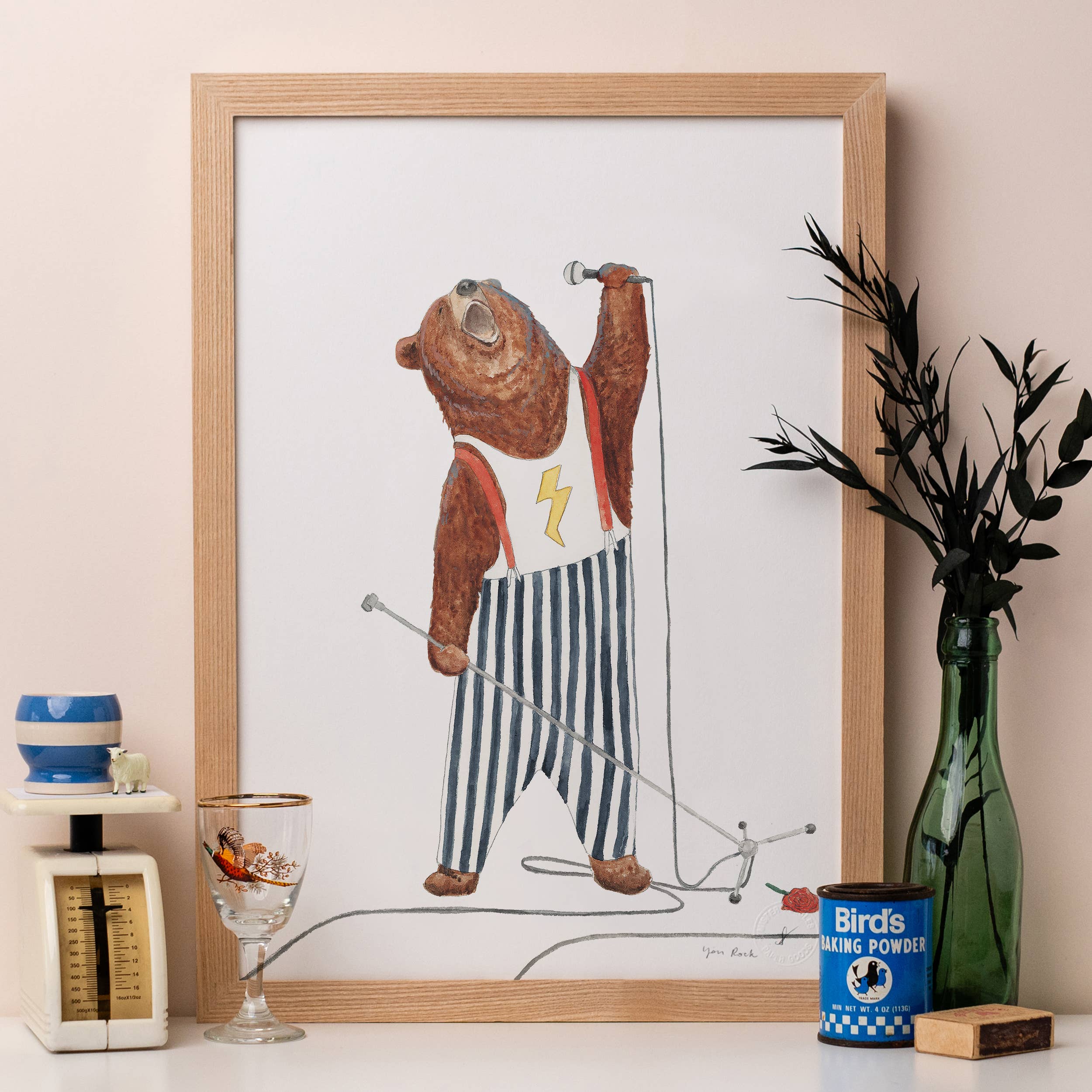 Framed illustration of a bear singing with a microphone.